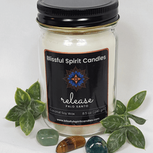 Load image into Gallery viewer, coconut soy candle with wooden wick 8.5 oz mason jar with black lid - text candle name release, white prop background, Palo Santo fragrance