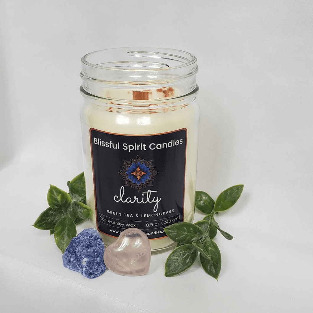 coconut soy candle with wooden wick 8.5 oz mason jar with black lid - text candle name Clarity white prop background, green tea and lemongrass fragrance