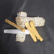 Load image into Gallery viewer, Energy Clearing Bundle 1 4&#39; bundle of sage and another of blue sage, 4 Palo Santo sticks, 1 4&quot; selenite crystal wand. black background
