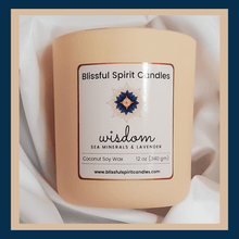 Load image into Gallery viewer, coconut soy candle with wooden wick 12 oz aura vessel- text candle name wisdom, white prop background, sea minerals and lavender fragrance
